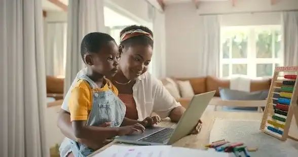 mother and child using laptop