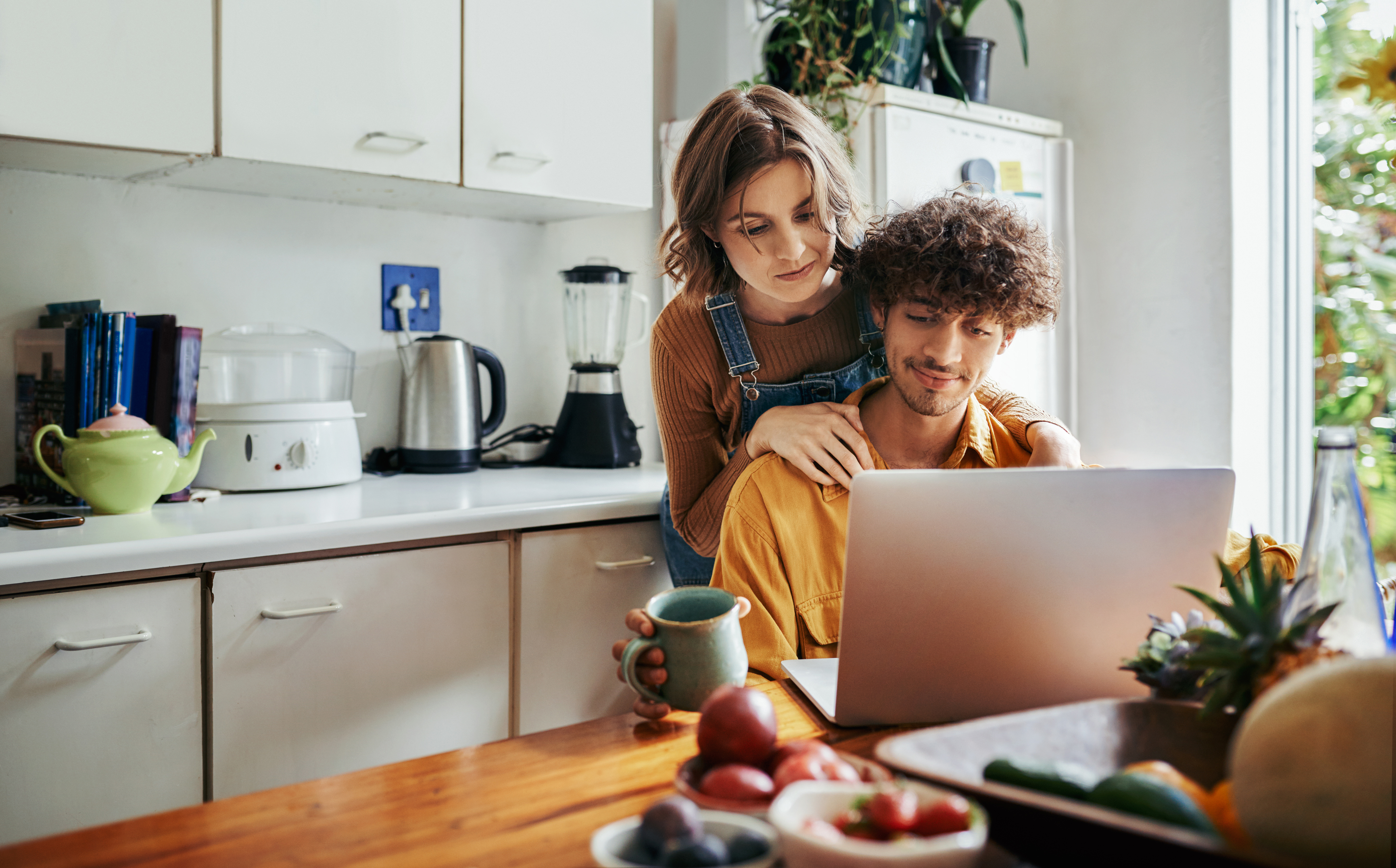 Young Couple Looking at Laptop